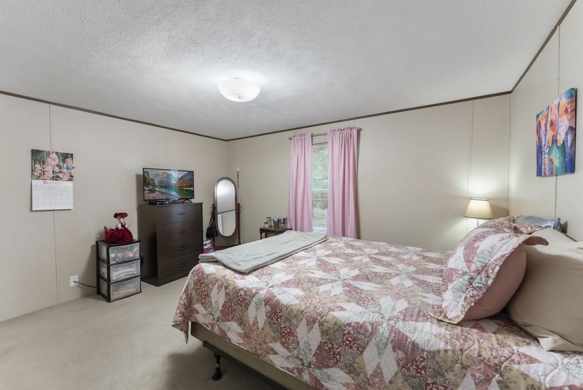 6913 Fm 3081 Road Willis, TX 77378 - Photo 41 of 46 a bedroom with a bed and cabinets