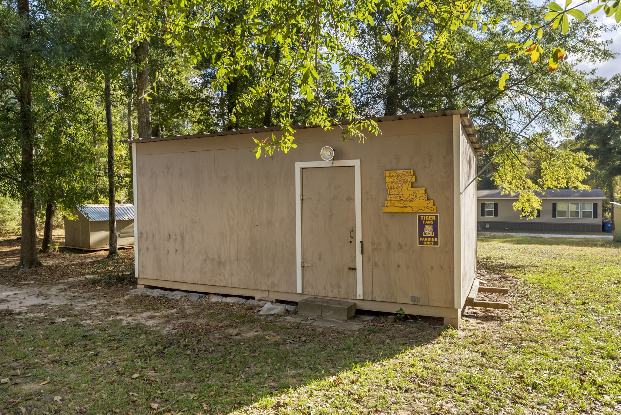6913 Fm 3081 Road Willis, TX 77378 - Photo 44 of 46 a backyard of a house with lots of green space