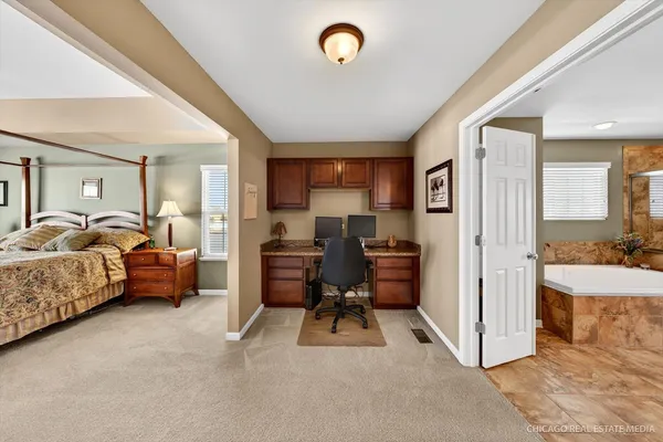 a view of living room filled with furniture and a chandelier