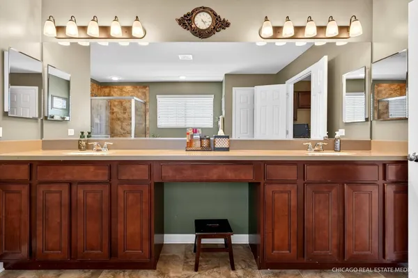 a bathroom with a sink and a large mirror