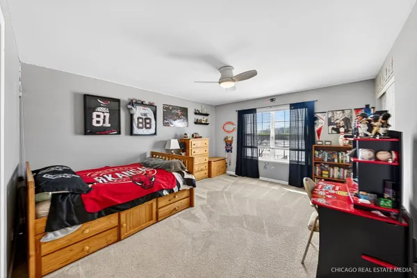 a bedroom with furniture and a bed