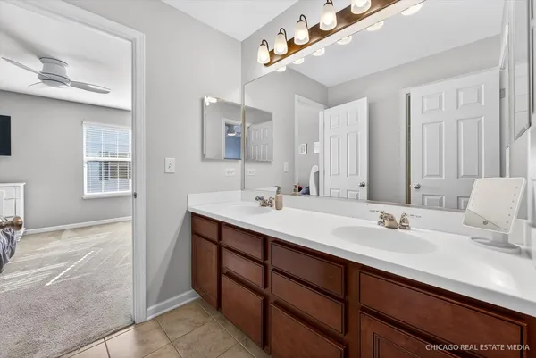 a bathroom with a sink double vanity and a mirror