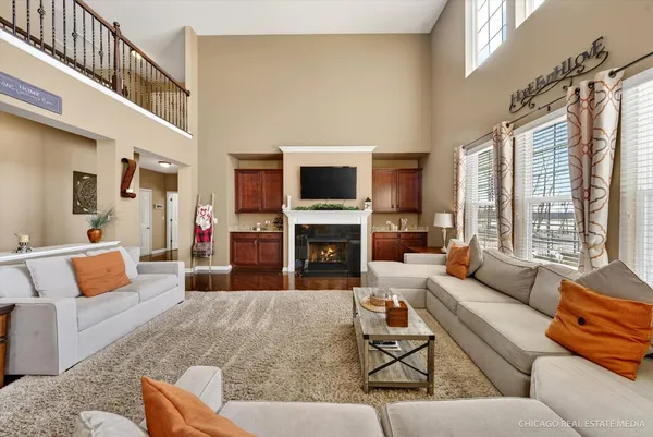 a living room with furniture fireplace and a flat screen tv