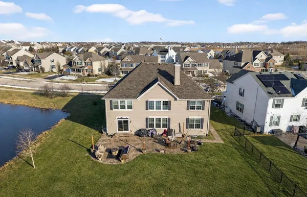 a aerial view of a house with table and chairs