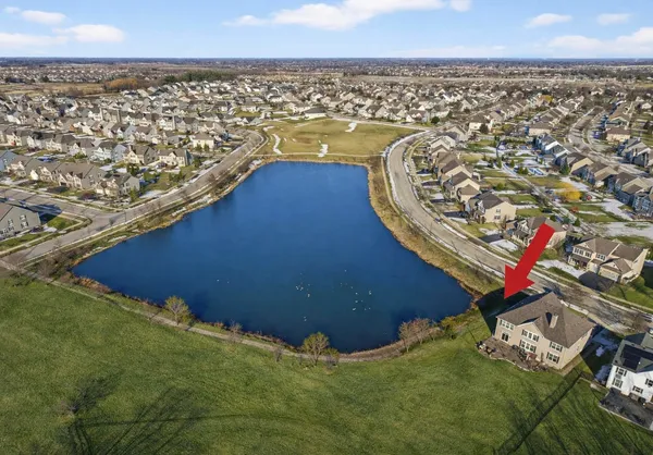 an aerial view of residential houses with outdoor space