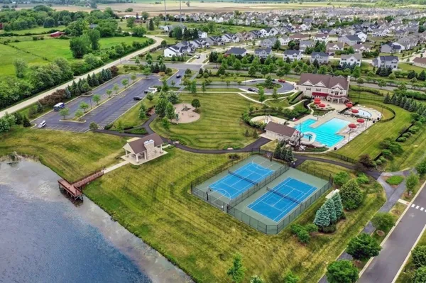 an aerial view of a house with a ocean view
