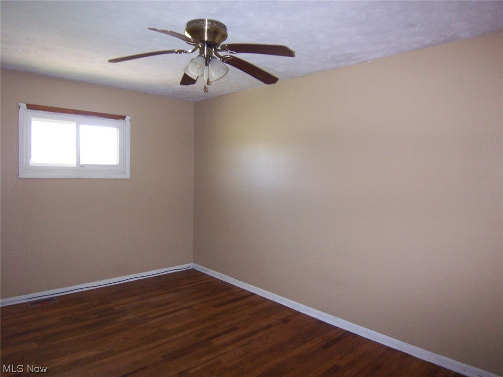 5968 Norwalk Road Medina, OH 44256 - Photo 7 of 12 Bedroom with hardwood floors and ceiling fan
