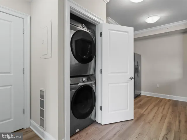 a view of a hallway with washer and dryer