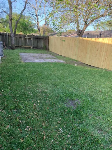 a view of backyard with green space