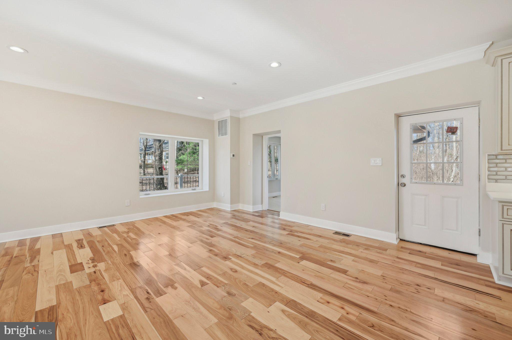 11990 Hall Shop Road Clarksville, MD 21029 - Photo 11 of 64 a view of empty room with wooden floor and fan