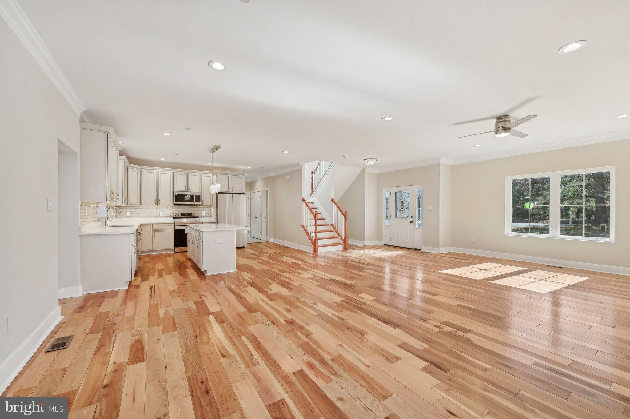 11990 Hall Shop Road Clarksville, MD 21029 - Photo 13 of 64 a view of empty room with wooden floor and window