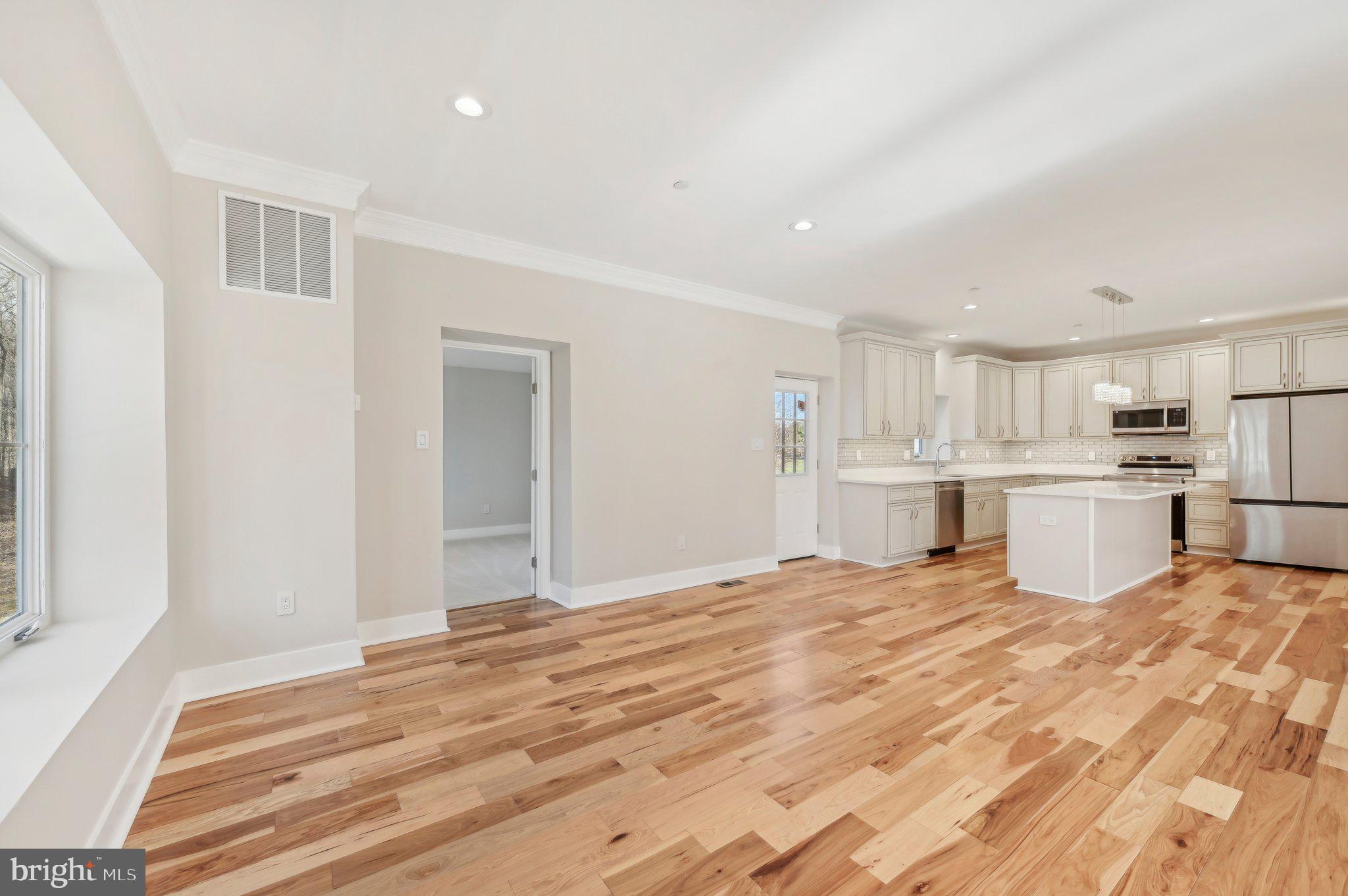 11990 Hall Shop Road Clarksville, MD 21029 - Photo 14 of 64 a view of a kitchen with sink microwave and cabinets