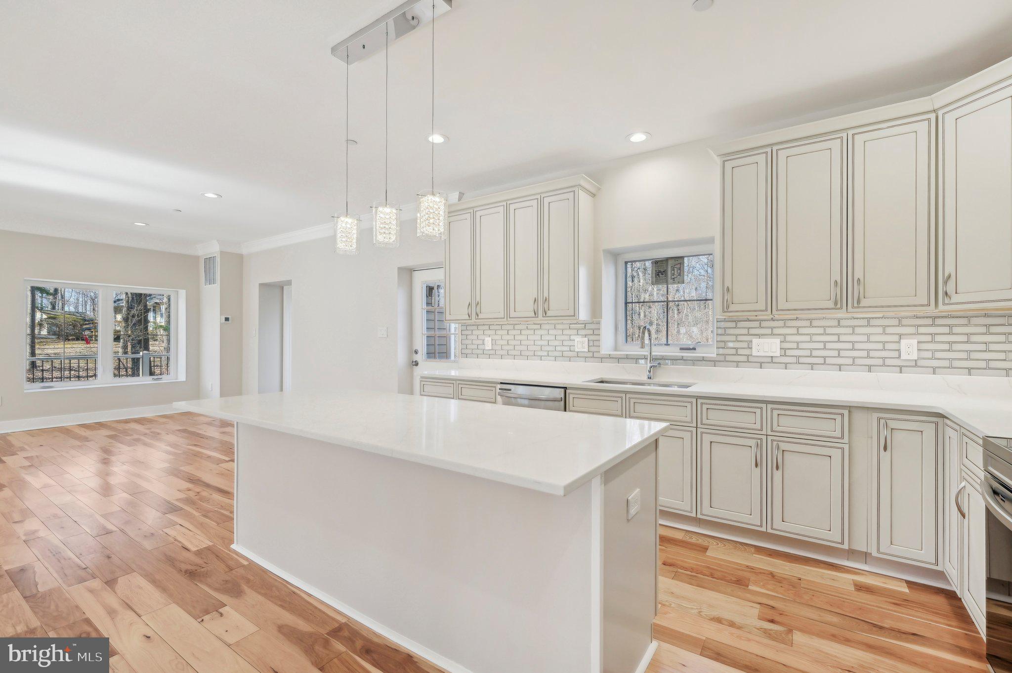 11990 Hall Shop Road Clarksville, MD 21029 - Photo 18 of 64 a large kitchen with kitchen island a sink stainless steel appliances and cabinets