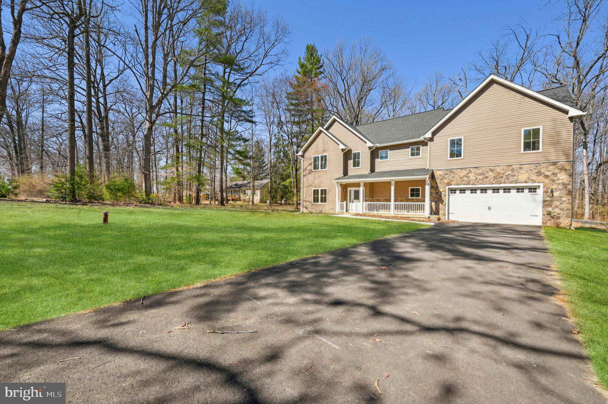 11990 Hall Shop Road Clarksville, MD 21029 - Photo 2 of 64 a front view of a house with a yard