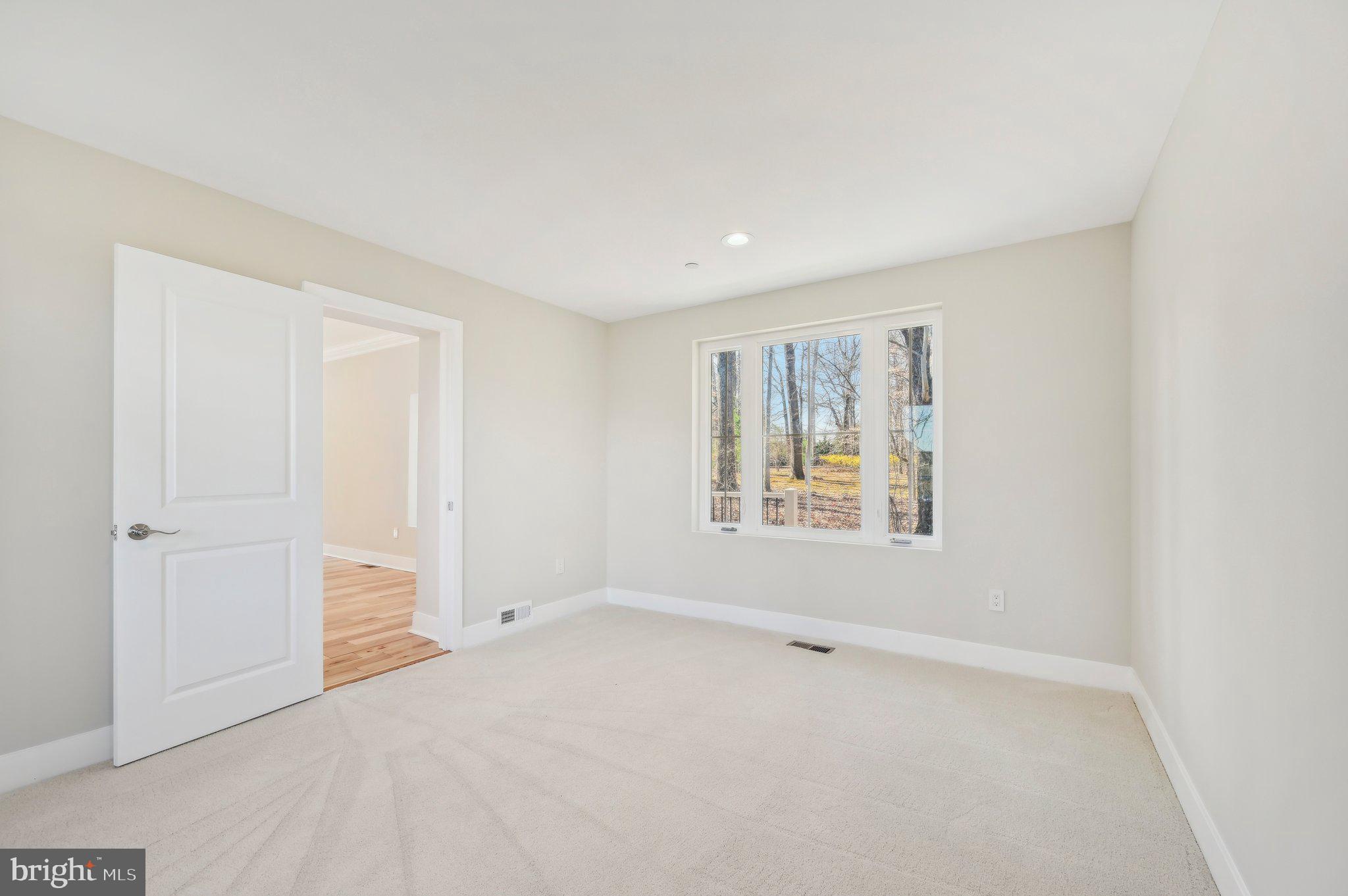 11990 Hall Shop Road Clarksville, MD 21029 - Photo 22 of 64 an empty room with a empty space and windows