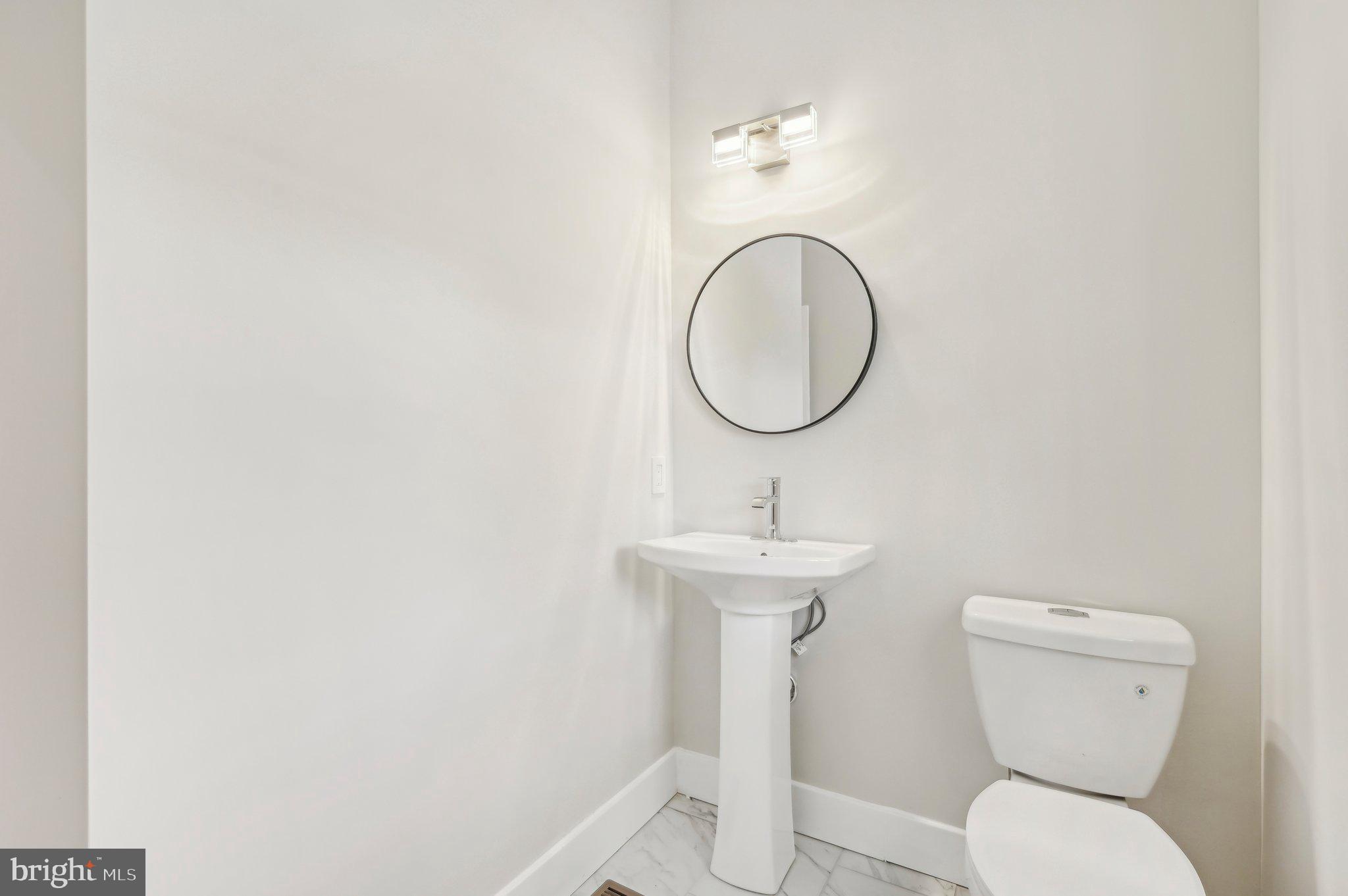 11990 Hall Shop Road Clarksville, MD 21029 - Photo 24 of 64 a bathroom with a toilet and a sink