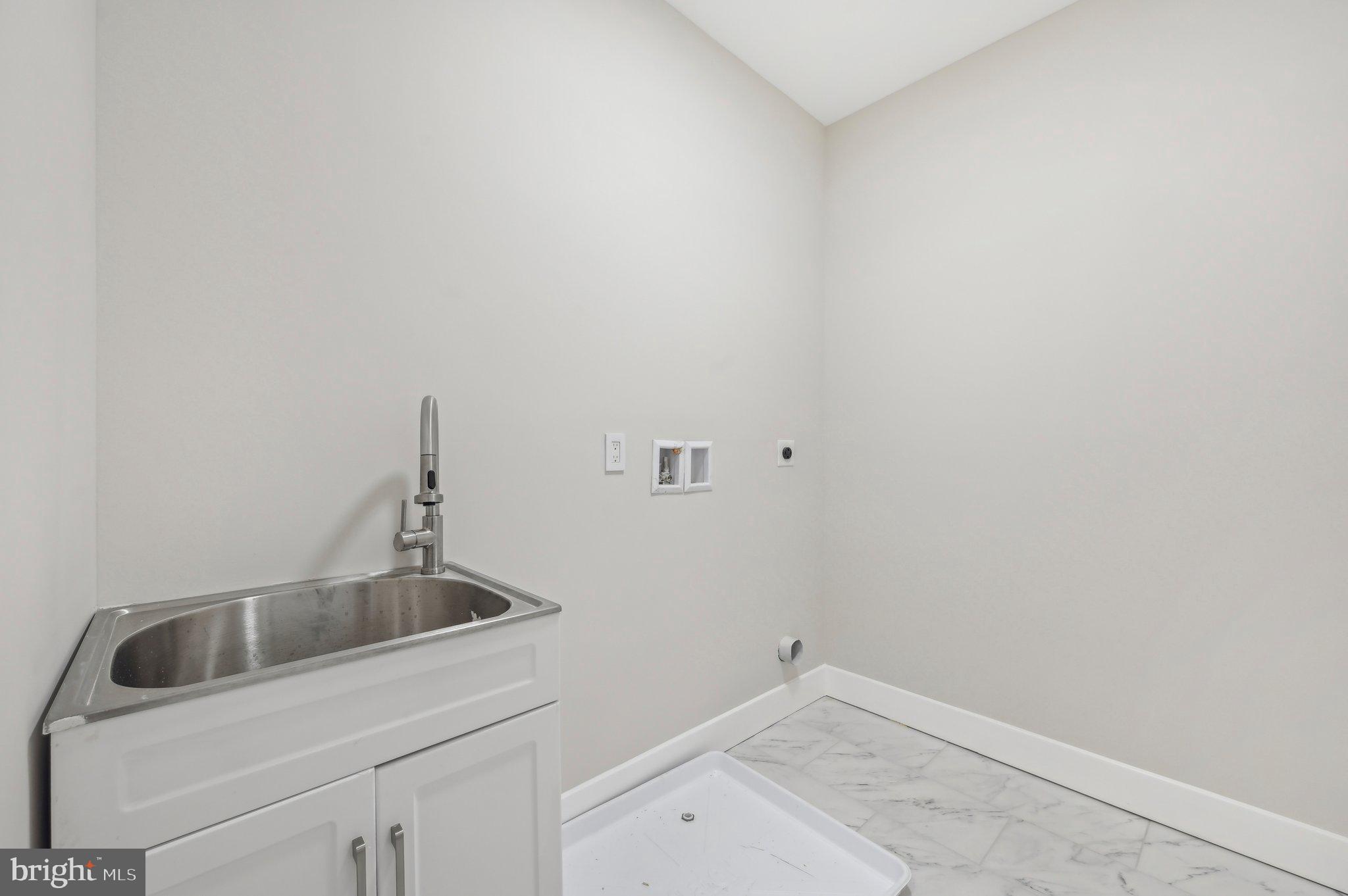 11990 Hall Shop Road Clarksville, MD 21029 - Photo 26 of 64 a bathroom with a sink and cabinets