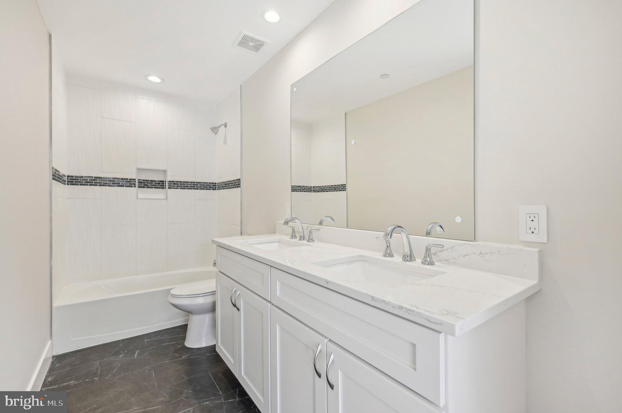 11990 Hall Shop Road Clarksville, MD 21029 - Photo 37 of 64 a bathroom with a toilet a sink and a bathtub