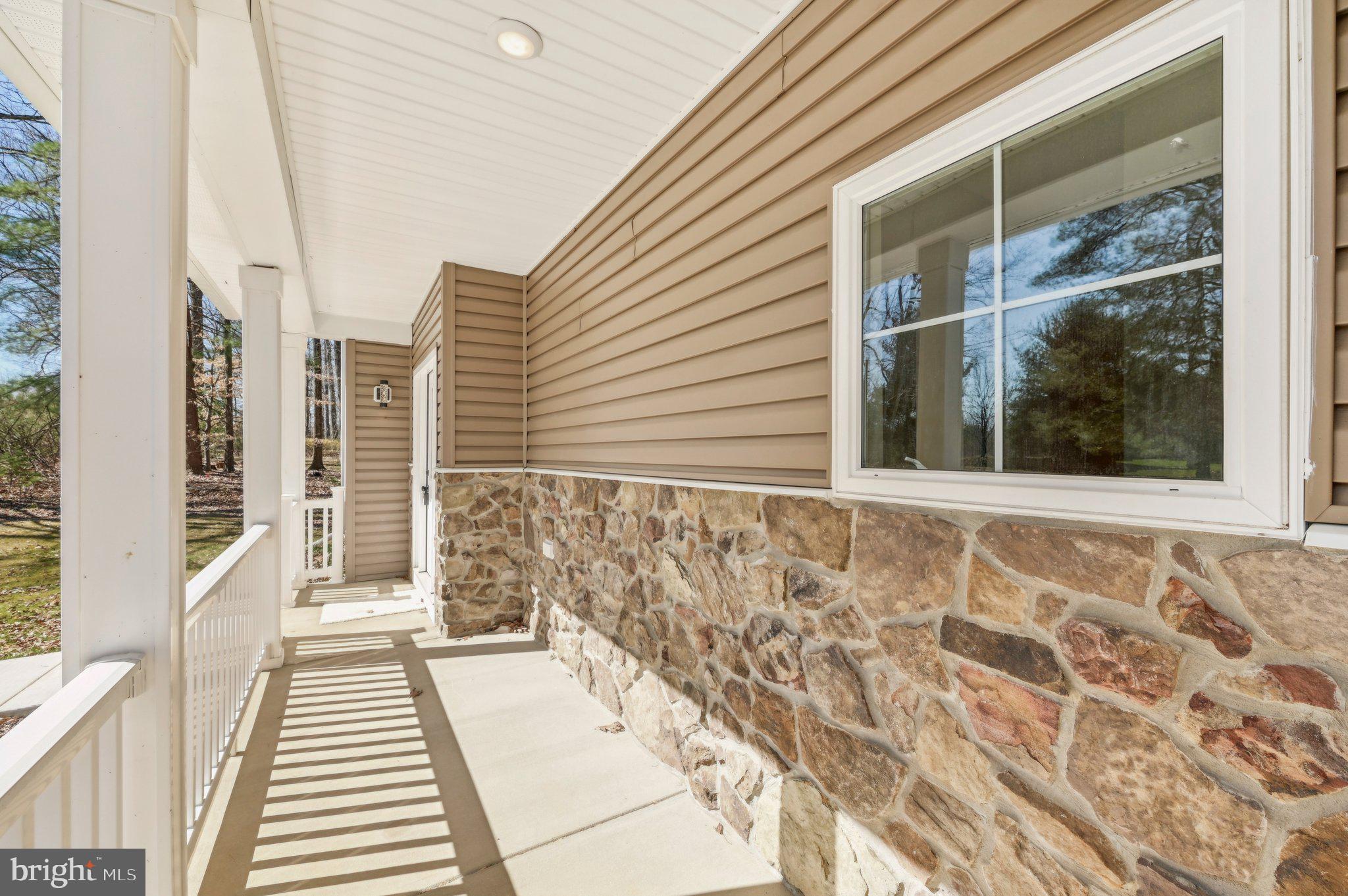 11990 Hall Shop Road Clarksville, MD 21029 - Photo 4 of 64 a view of a balcony with wooden floor and windows