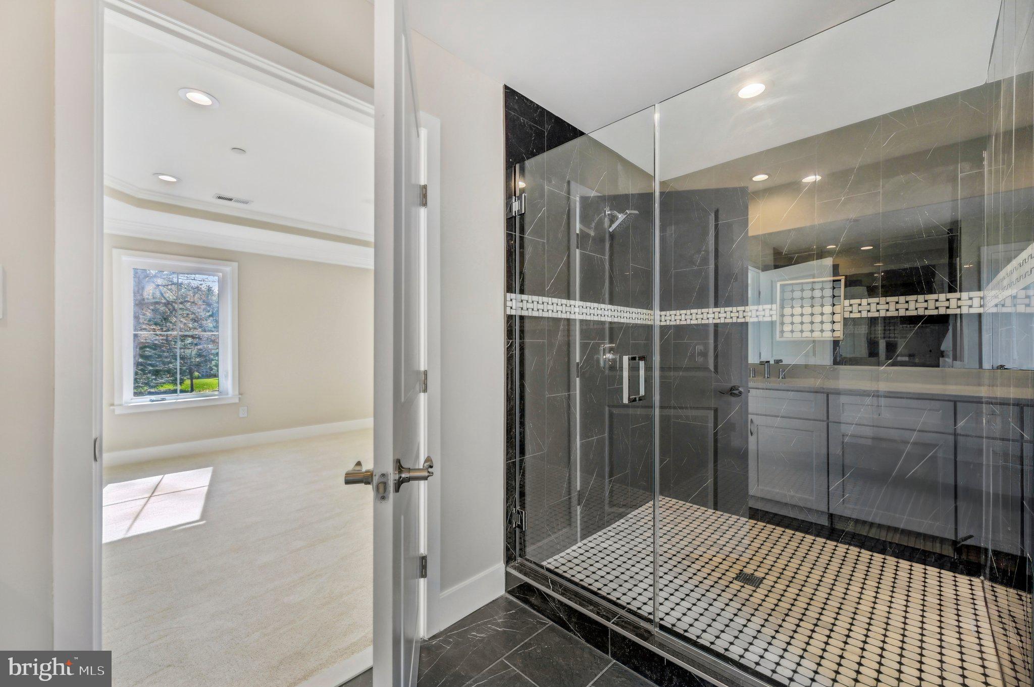 11990 Hall Shop Road Clarksville, MD 21029 - Photo 48 of 64 a bathroom with a glass shower door and a window