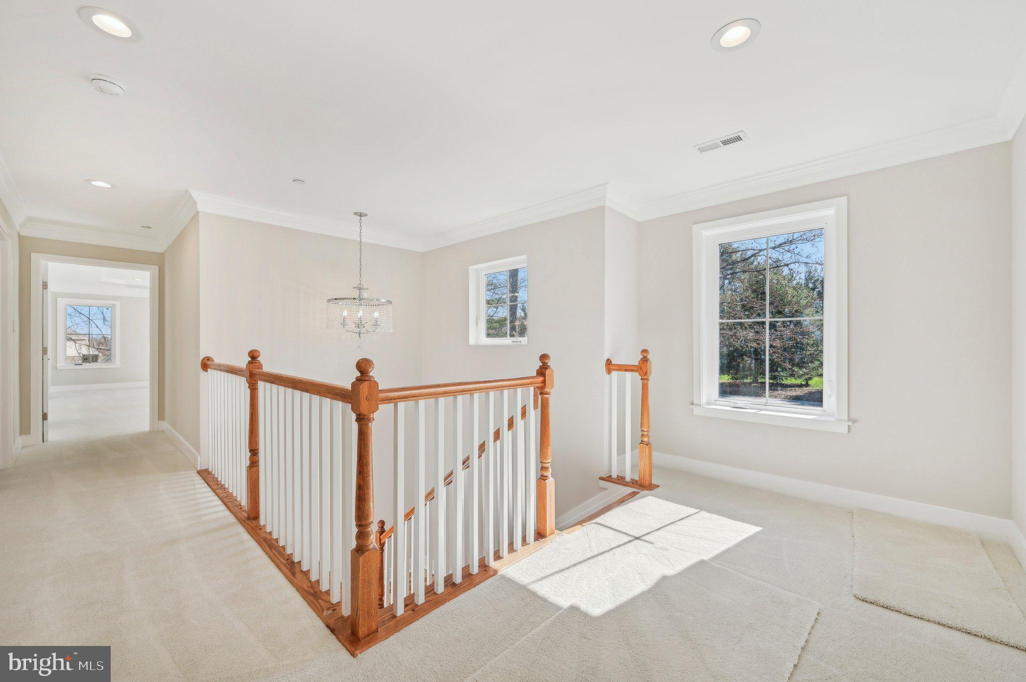 11990 Hall Shop Road Clarksville, MD 21029 - Photo 53 of 64 a view of a hallway with windows and stairs