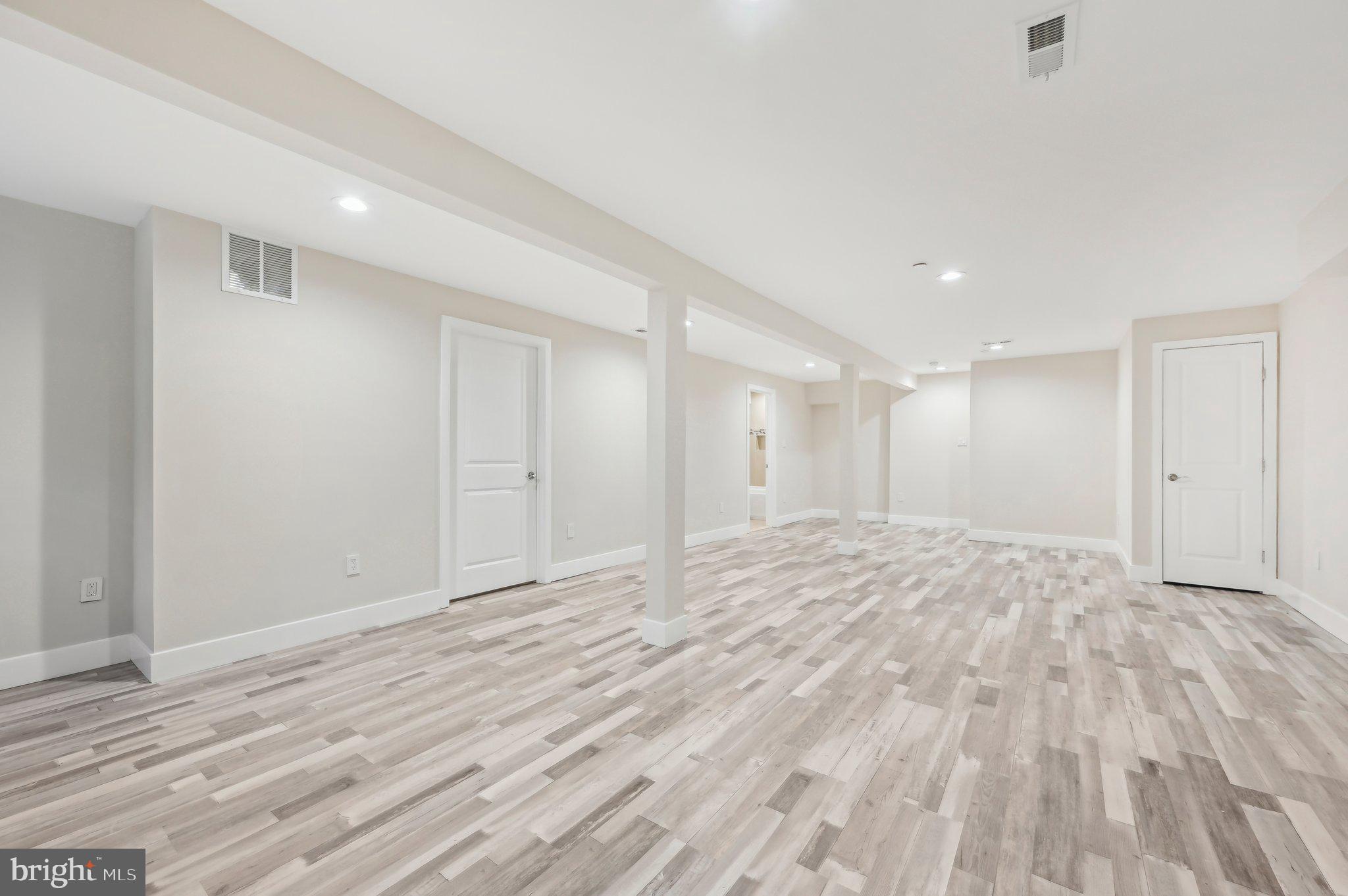 11990 Hall Shop Road Clarksville, MD 21029 - Photo 56 of 64 a view of empty room with wooden floor