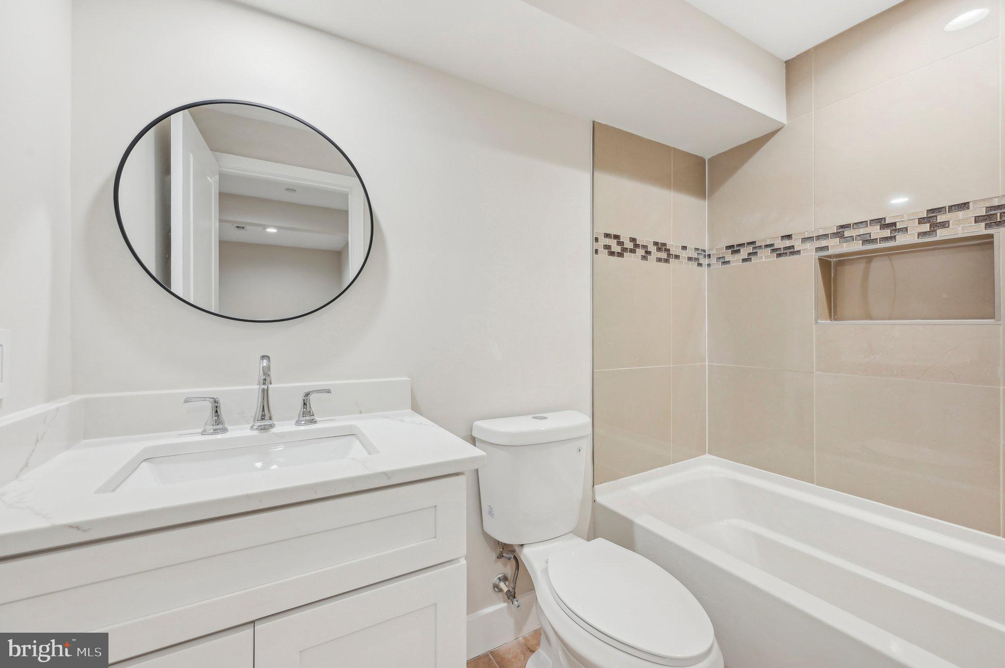 11990 Hall Shop Road Clarksville, MD 21029 - Photo 58 of 64 a bathroom with a sink toilet and a mirror