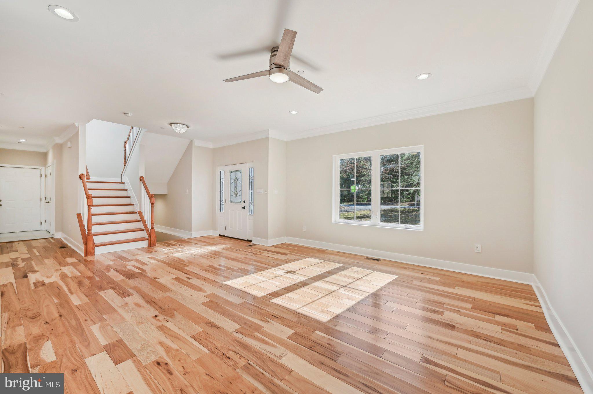 11990 Hall Shop Road Clarksville, MD 21029 - Photo 7 of 64 a view of an empty room with wooden floor and a window