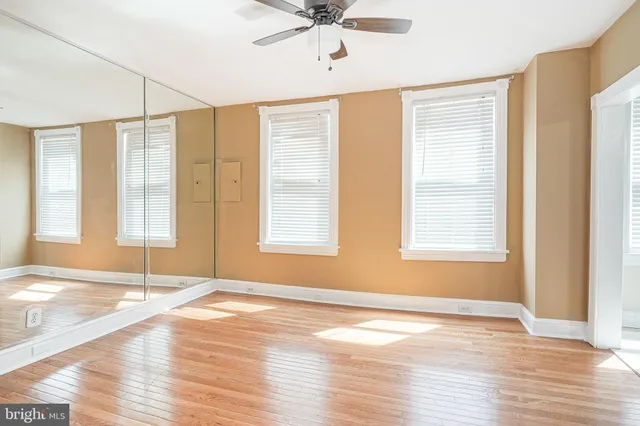 a view of kitchen with a sink cabinet and window