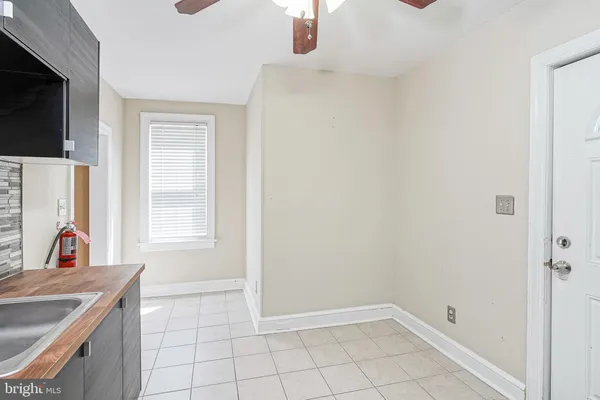 a kitchen with stainless steel appliances granite countertop a sink a stove and refrigerator