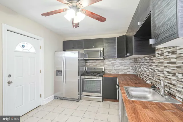 a view of a room with wooden walls