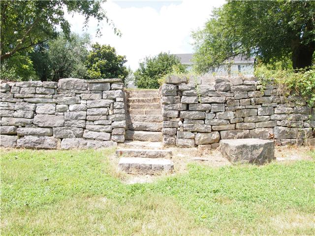 3096 Dodson Gap Road Culleoka, TN 38451 - Photo 2 of 20 Stacked stone rock wall in front of residence