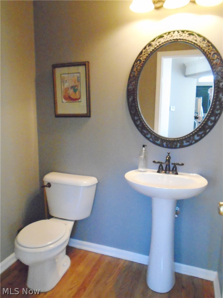 4205 Devonshire Akron, OH 44321 - Photo 15 of 35 guest bath with wood floors and pedastal sink.