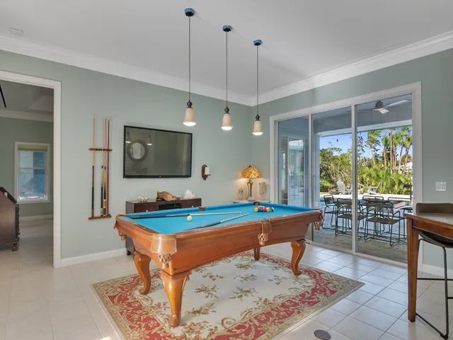 a view of a livingroom with furniture and a flat screen tv