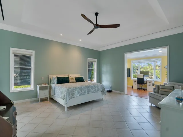 a room with a bed and furniture