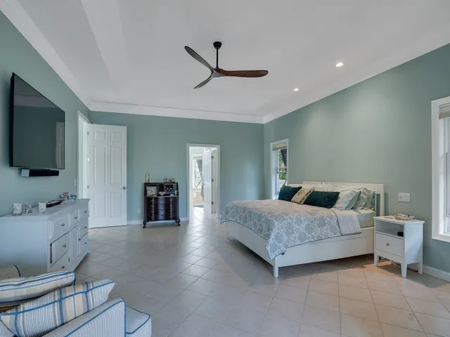 a bathroom with a tub a sink and mirror