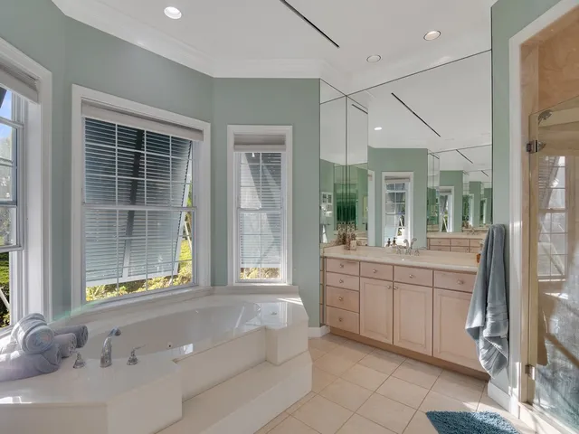 a view of a workspace with furniture and a potted plant