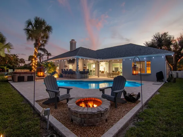 swimming pool view with a seating space