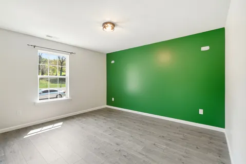a view of a big room with windows and closet