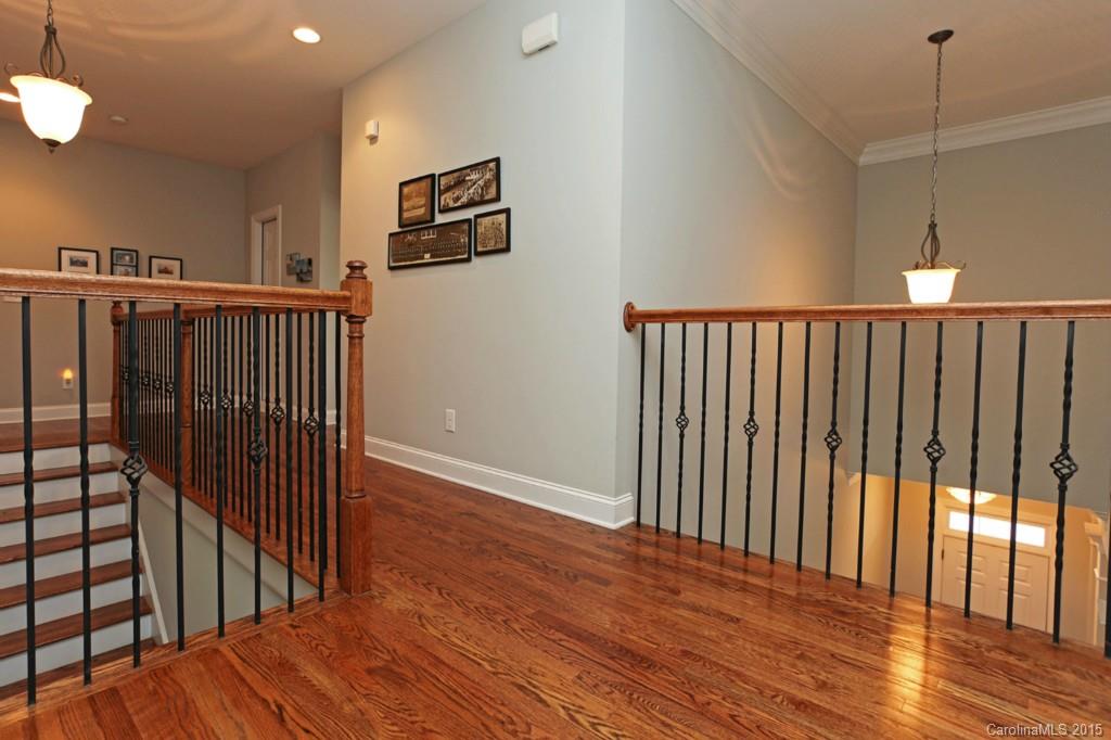 671 Revival Row Fort Mill, SC 29708 - Photo 15 of 24 a view of a hallway with wooden floor