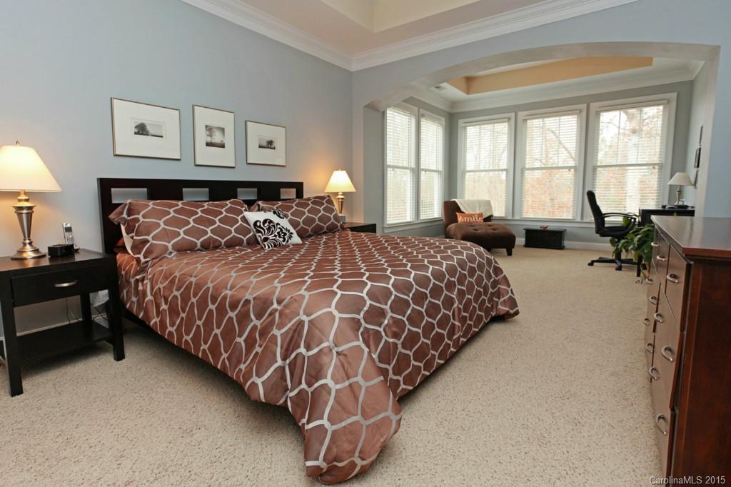 671 Revival Row Fort Mill, SC 29708 - Photo 16 of 24 a bedroom with a bed couch and window