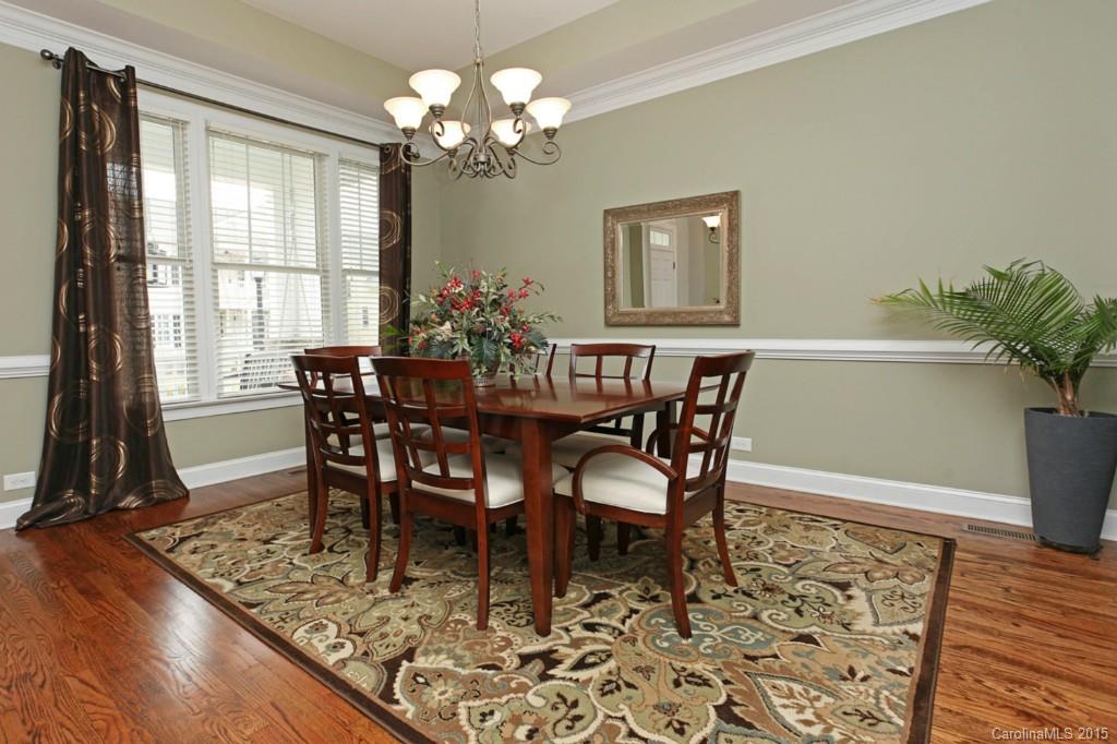 671 Revival Row Fort Mill, SC 29708 - Photo 4 of 24 a view of a dining room with furniture window and wooden floor