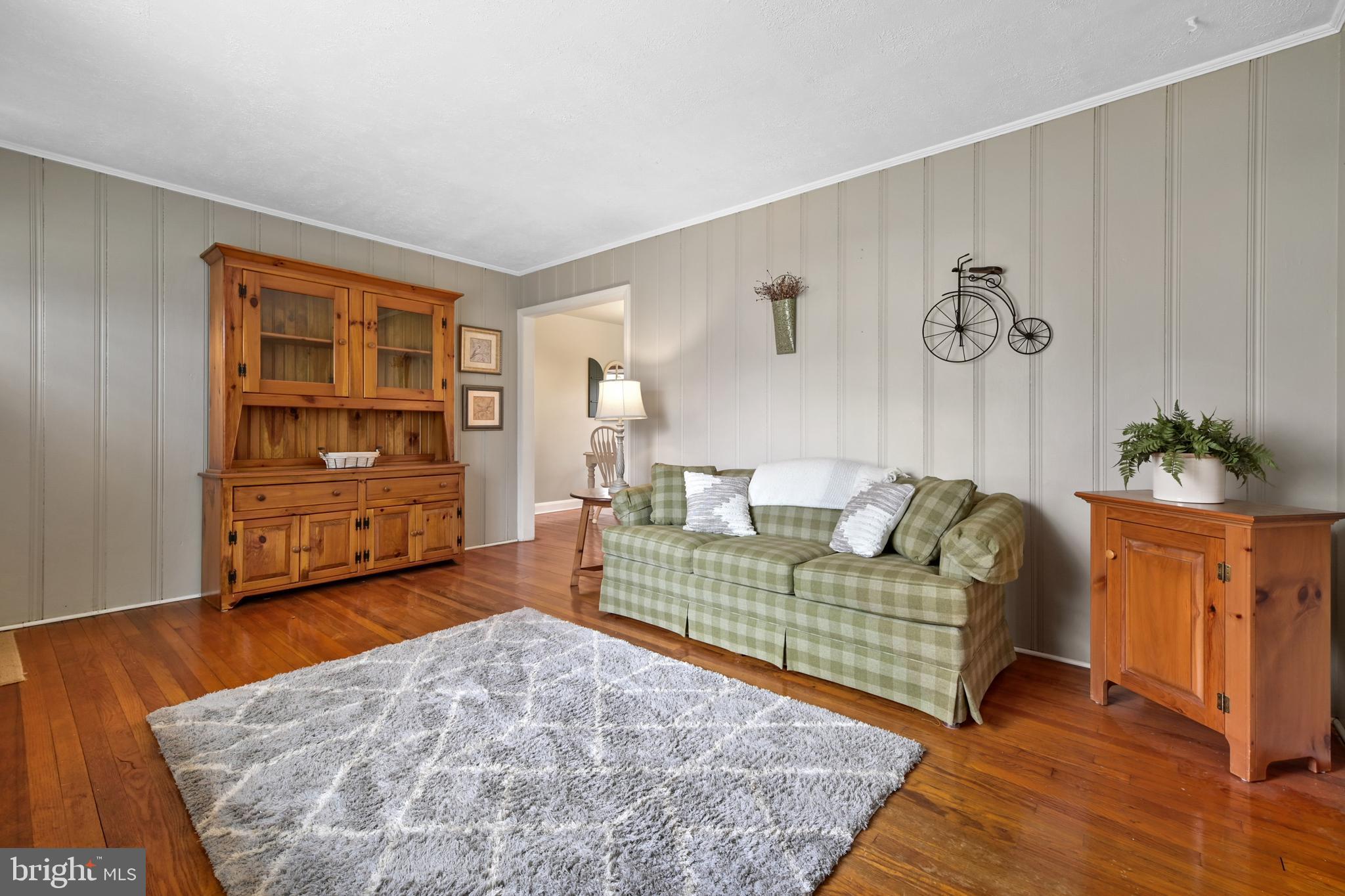 8437 Alvin Road Pasadena, MD 21122 - Photo 5 of 39 Hardwoods continue throughout home.