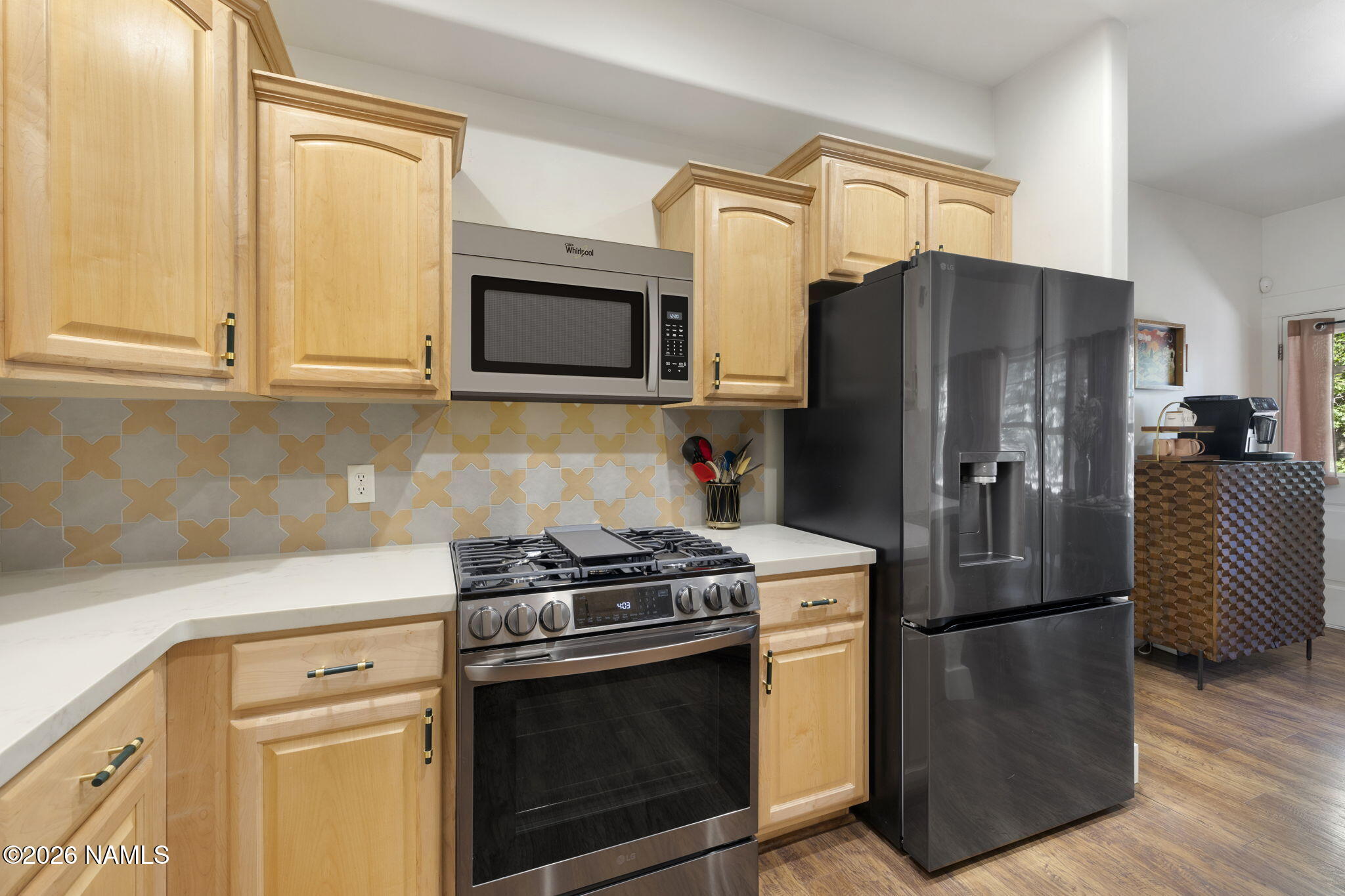3495 West Lead Rope Flagstaff, AZ 86005 - Photo 20 of 49 a kitchen with stainless steel appliances granite countertop a refrigerator stove and microwave