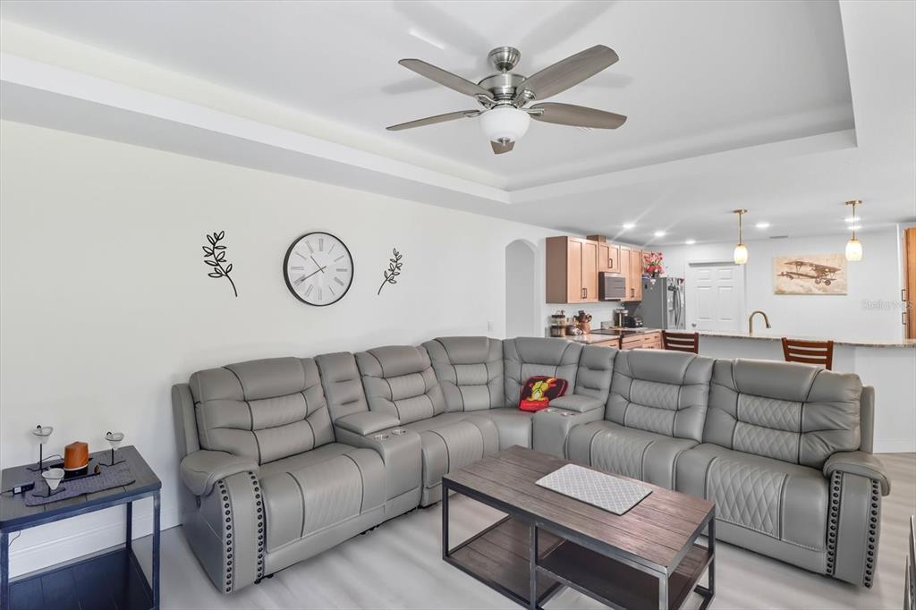 5032 North Crossgate Point Beverly Hills, FL 34465 - Photo 20 of 43 a living room with furniture a clock on a desk and couches