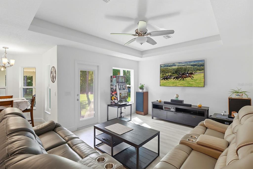 5032 North Crossgate Point Beverly Hills, FL 34465 - Photo 22 of 43 a living room with furniture and a large window