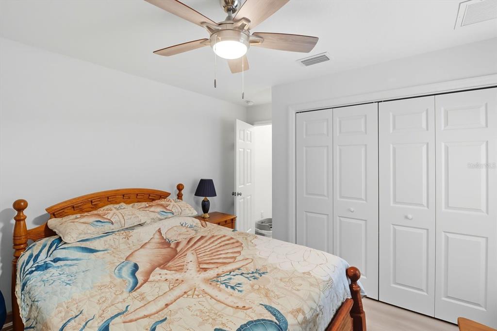 5032 North Crossgate Point Beverly Hills, FL 34465 - Photo 33 of 43 a bedroom with a bed and a chandelier