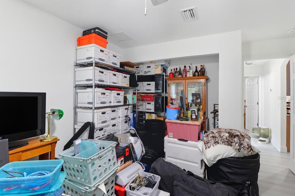 5032 North Crossgate Point Beverly Hills, FL 34465 - Photo 38 of 43 a bedroom with furniture and a flat screen tv