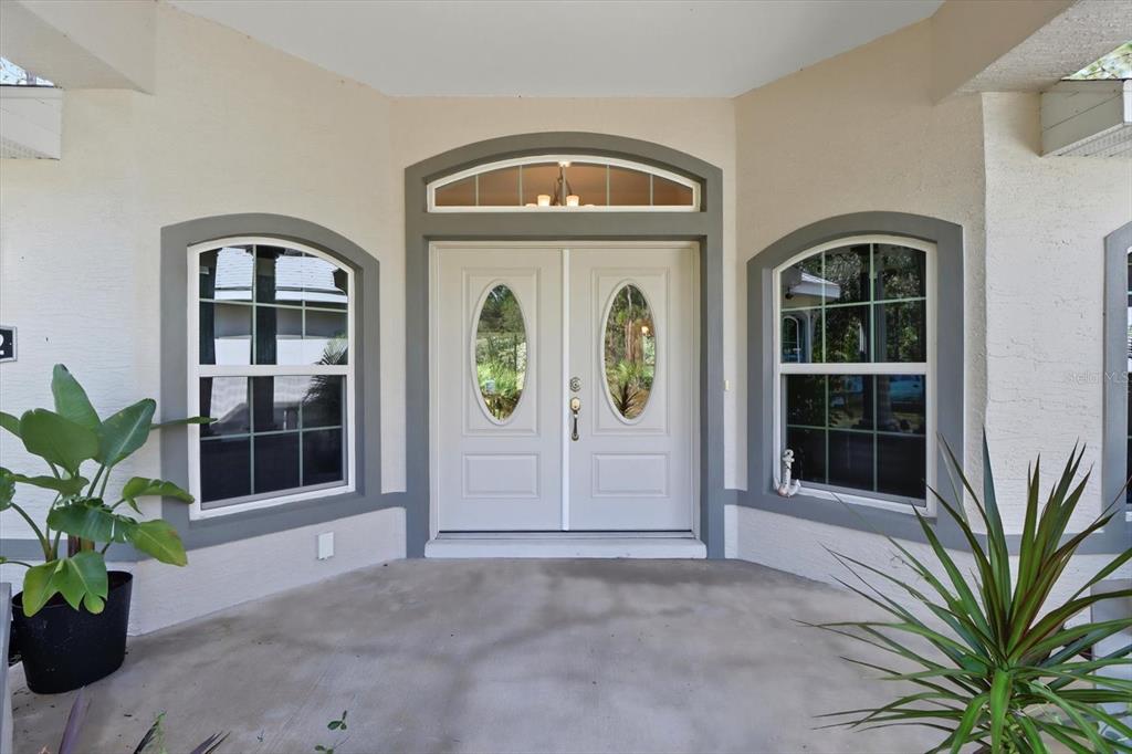 5032 North Crossgate Point Beverly Hills, FL 34465 - Photo 7 of 43 a front view of a house with garden