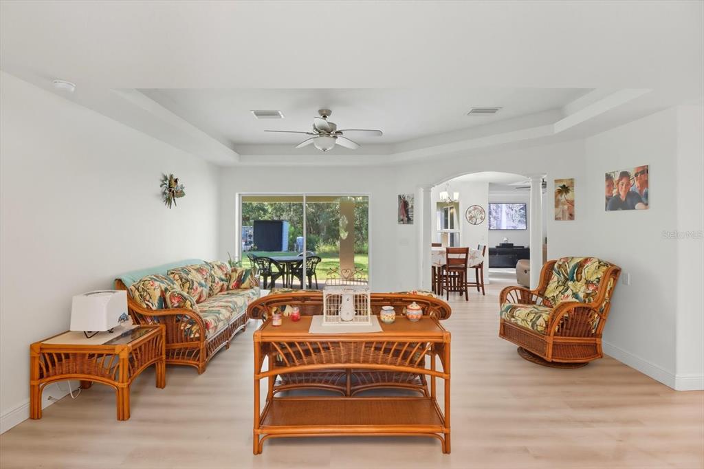 5032 North Crossgate Point Beverly Hills, FL 34465 - Photo 9 of 43 a living room with furniture a table and a large window